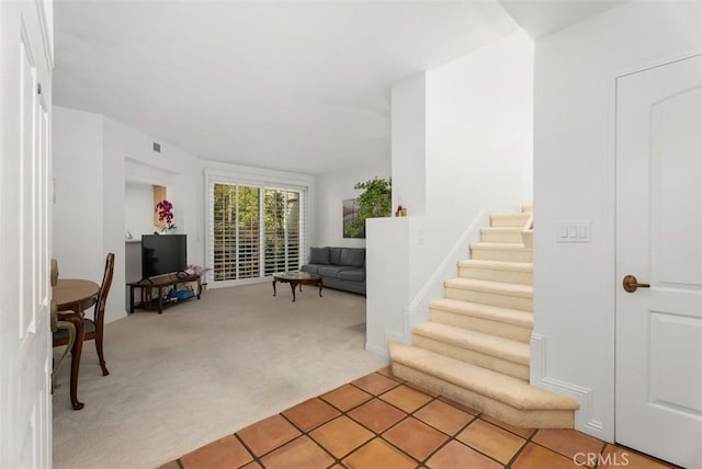 2303 Paseo Circulo, Tustin, CA 92782 - foyer entrance with light colored carpet and stairway