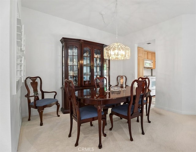 2303 Paseo Circulo, Tustin, CA 92782 - dining area featuring a chandelier and light colored carpet