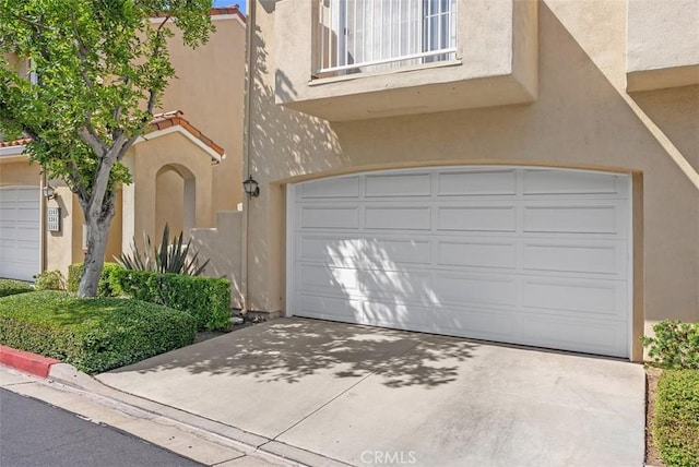 2303 Paseo Circulo, Tustin, CA 92782 - view of front of property with stucco siding, a garage, and driveway