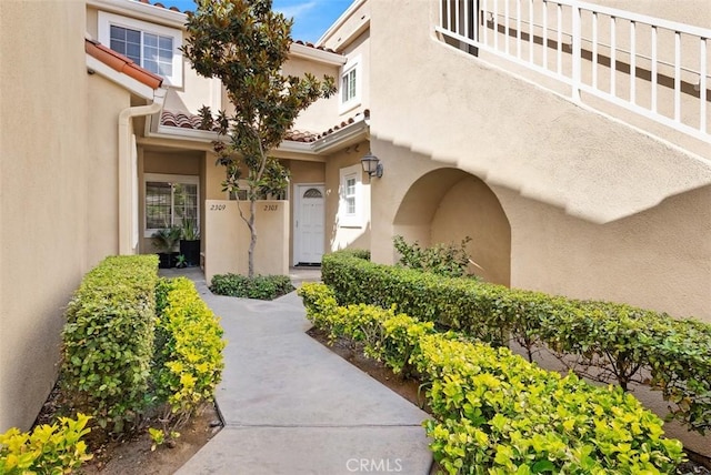 2303 Paseo Circulo, Tustin, CA 92782 - entrance to property with stucco siding and a balcony