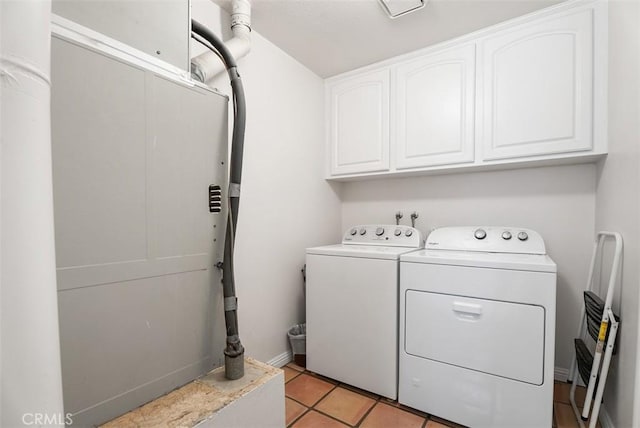 2303 Paseo Circulo, Tustin, CA 92782 - washroom featuring washing machine and dryer, cabinet space, and light tile patterned flooring