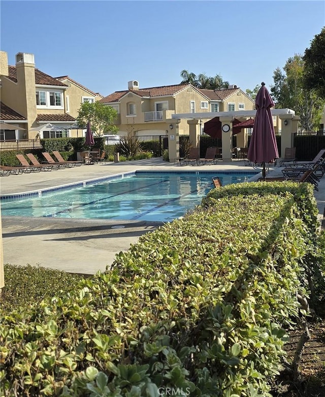 2303 Paseo Circulo, Tustin, CA 92782 - community pool featuring a residential view and a patio