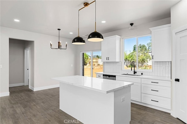 6388 Oak Rd, Paradise, CA 95969 - kitchen with recessed lighting, a center island, backsplash, stainless steel dishwasher, and white cabinetry