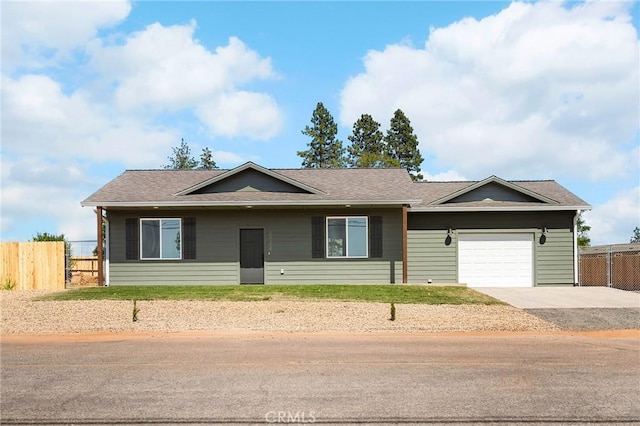 6388 Oak Rd, Paradise, CA 95969 - ranch-style house with concrete driveway and an attached garage