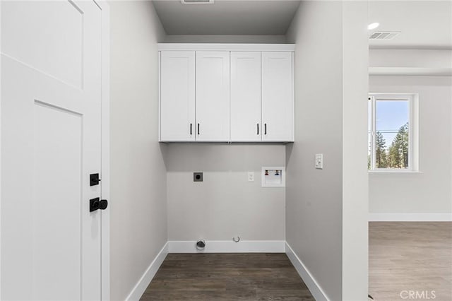 6388 Oak Rd, Paradise, CA 95969 - washroom featuring hookup for a washing machine, dark wood-style flooring, cabinet space, and hookup for an electric dryer