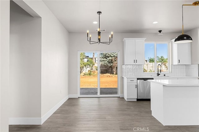 6388 Oak Rd, Paradise, CA 95969 - unfurnished dining area featuring recessed lighting, a chandelier, plenty of natural light, and wood finished floors