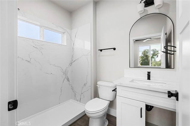 6388 Oak Rd, Paradise, CA 95969 - bathroom featuring healthy amount of natural light, a marble finish shower, vanity, and wood finished floors