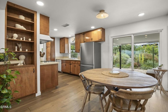 80 Watkins Way, Oak View, CA 93022 - kitchen with white appliances, light countertops, brown cabinets, light wood-style floors, and recessed lighting