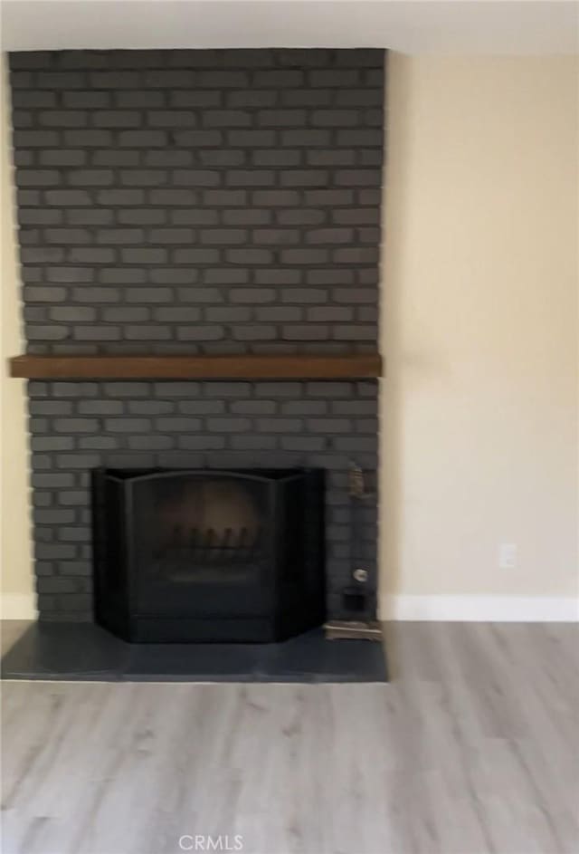 3195 Camarillo Ave, Oceanside, CA 92056 - detailed view of a fireplace and wood finished floors