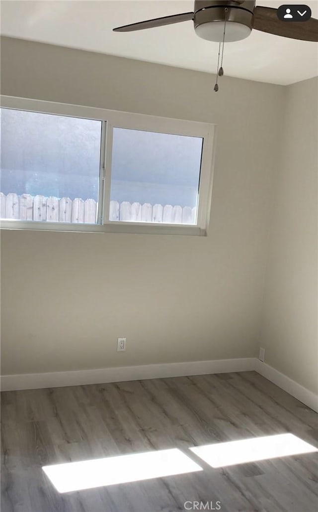 3195 Camarillo Ave, Oceanside, CA 92056 - spare room with wood finished floors, a ceiling fan, and healthy amount of natural light