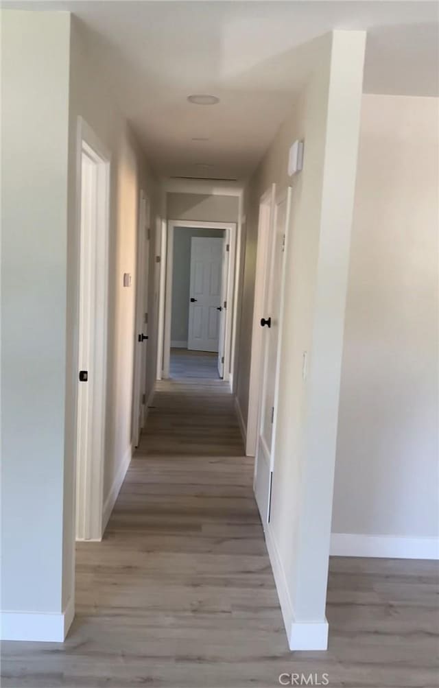3195 Camarillo Ave, Oceanside, CA 92056 - corridor featuring baseboards and light wood-style floors