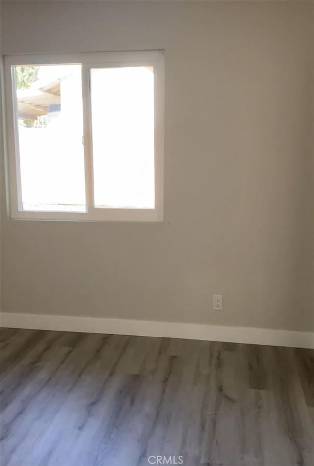 3195 Camarillo Ave, Oceanside, CA 92056 - unfurnished room with baseboards and wood finished floors
