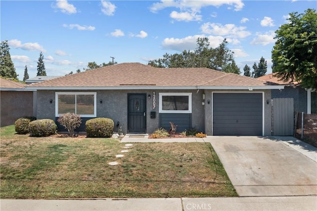 12007 163rd St, Norwalk, CA 90650 - single story home with a garage, concrete driveway, a front lawn, and stucco siding