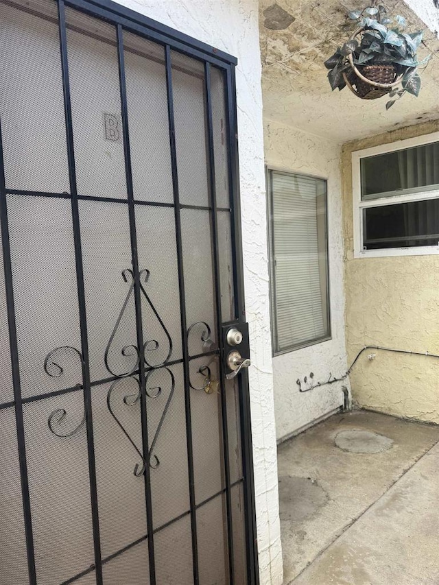 384 I St, Chula Vista, CA 91910 - entrance to property featuring a gate and stucco siding
