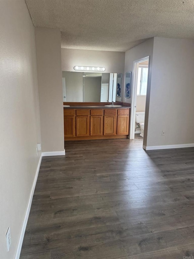 384 I St, Chula Vista, CA 91910 - full bathroom with double vanity, wood finished floors, and a textured ceiling