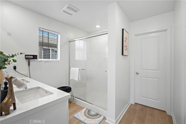 2239 Melogold Way, Corona, CA 92883 - full bath featuring wood finished floors, a shower stall, and vanity