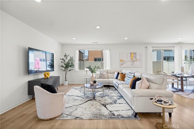 2239 Melogold Way, Corona, CA 92883 - living area with light wood finished floors and recessed lighting