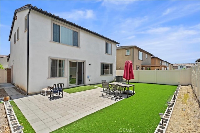 2239 Melogold Way, Corona, CA 92883 - back of house with stucco siding, a patio area, and a fenced backyard