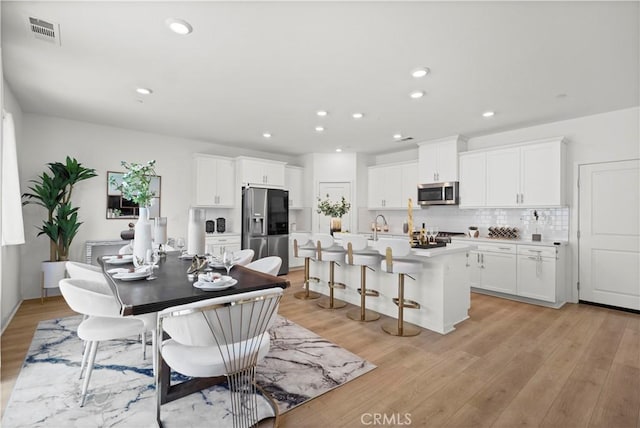 2239 Melogold Way, Corona, CA 92883 - dining area with light wood-type flooring and recessed lighting