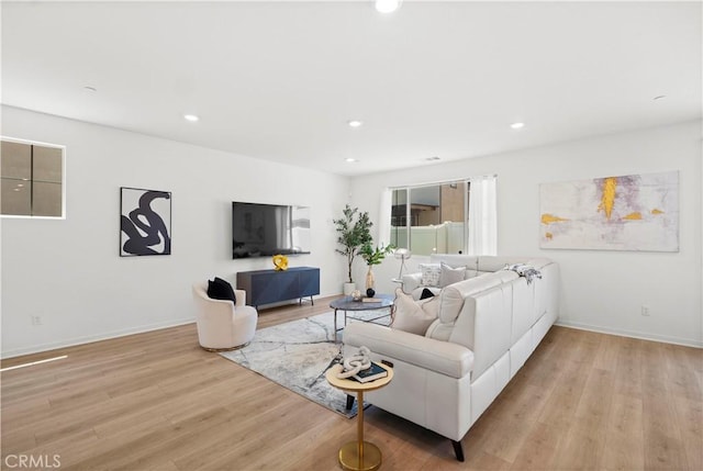 2239 Melogold Way, Corona, CA 92883 - living area featuring light wood-type flooring and recessed lighting