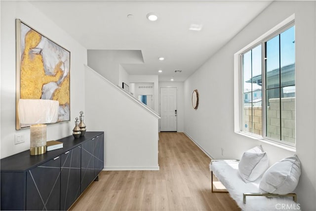2239 Melogold Way, Corona, CA 92883 - corridor with light wood finished floors, stairway, and recessed lighting