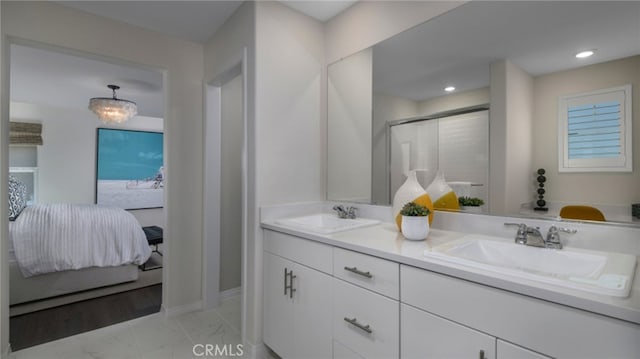 338 Fowler Way, Rialto, CA 92377 - full bath featuring connected bathroom, double vanity, marble finish flooring, an enclosed shower, and recessed lighting