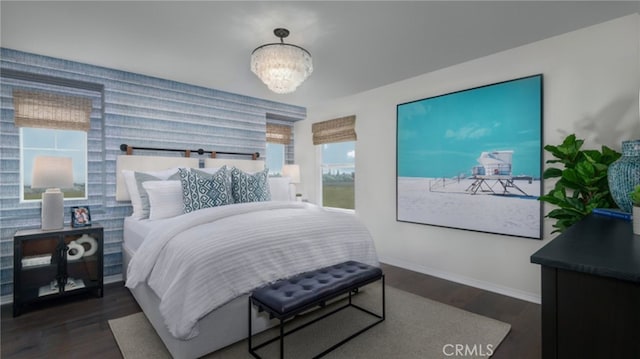 338 Fowler Way, Rialto, CA 92377 - bedroom with wood finished floors, a chandelier, wallpapered walls, and an accent wall