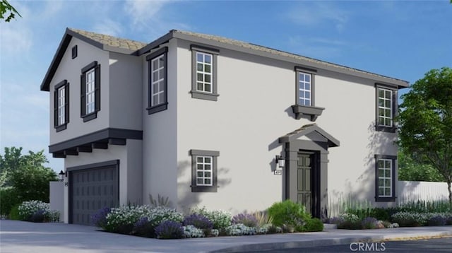 338 Fowler Way, Rialto, CA 92377 - view of front facade with stucco siding, an attached garage, and driveway