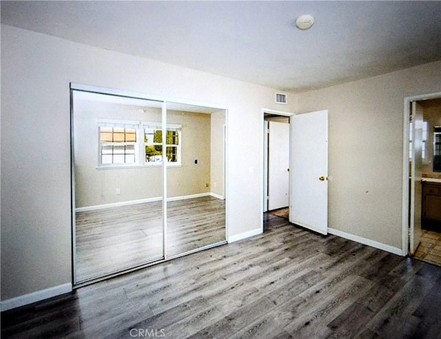 2756 Gallio Ave, Rowland Heights, CA 91748 - unfurnished bedroom with wood finished floors, a closet, and ensuite bathroom