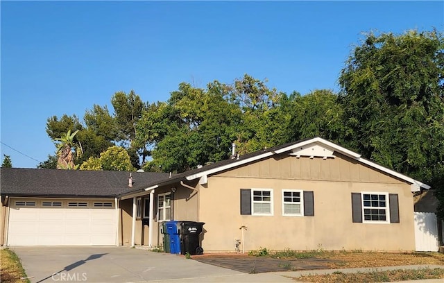 2756 Gallio Ave, Rowland Heights, CA 91748 - ranch-style home with concrete driveway, an attached garage, and board and batten siding