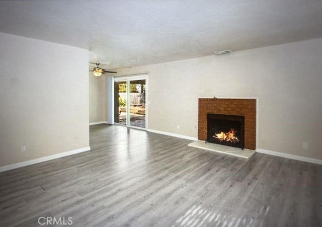 2756 Gallio Ave, Rowland Heights, CA 91748 - unfurnished living room with a ceiling fan, a fireplace, and wood finished floors