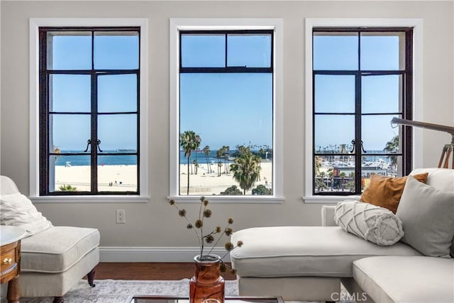 800 E Ocean Blvd Unit 201, Long Beach, CA 90802 - living area featuring wood finished floors and healthy amount of natural light