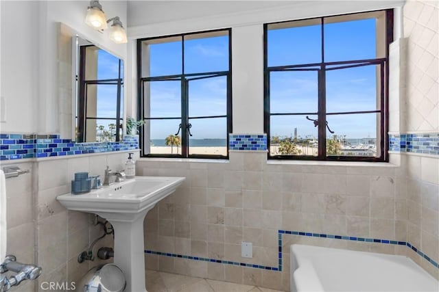 800 E Ocean Blvd Unit 201, Long Beach, CA 90802 - bathroom featuring tile walls, a bath, plenty of natural light, and tile patterned floors