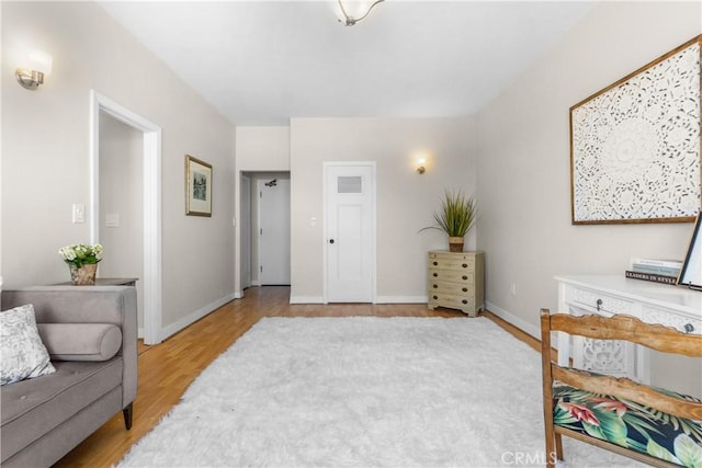 800 E Ocean Blvd Unit 201, Long Beach, CA 90802 - sitting room with light wood-style floors and baseboards