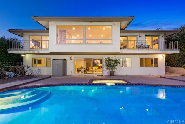 5946 Overlake Ave, Del Cerro, CA 92120 - rear view of property featuring a balcony, stucco siding, a patio area, and a pool with connected hot tub