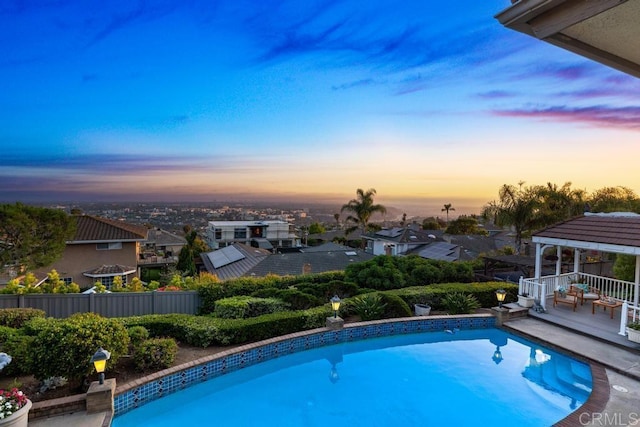 5946 Overlake Ave, Del Cerro, CA 92120 - pool at dusk featuring a gazebo, an outdoor pool, and a residential view