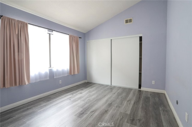 1818 W 145th St Unit 1, Gardena, CA 90249 - unfurnished bedroom featuring lofted ceiling, a closet, and wood finished floors