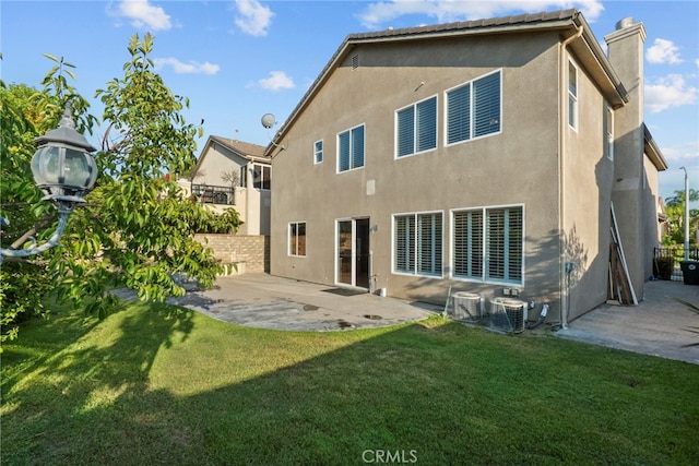 29243 Discovery Ridge Dr, Saugus, CA 91390 - back of property featuring a patio area, a chimney, and stucco siding