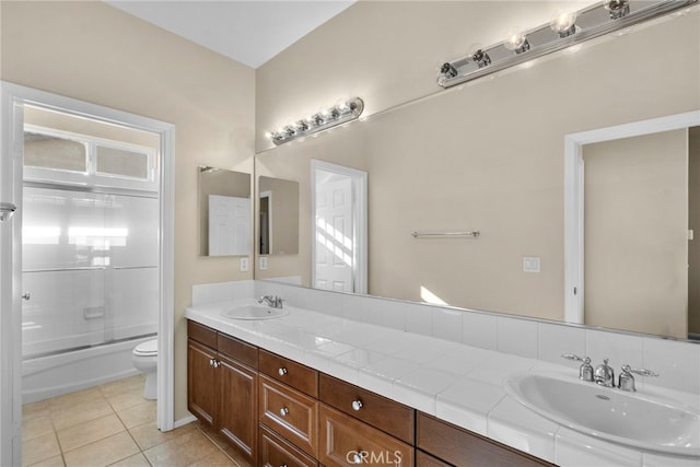 29243 Discovery Ridge Dr, Saugus, CA 91390 - bathroom featuring double vanity, tile patterned floors, and enclosed tub / shower combo