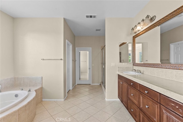 29243 Discovery Ridge Dr, Saugus, CA 91390 - bathroom featuring vanity, a bath, tile patterned floors, a stall shower, and decorative backsplash