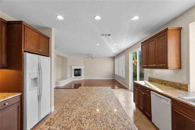 29243 Discovery Ridge Dr, Saugus, CA 91390 - kitchen with white appliances, light tile patterned flooring, recessed lighting, light stone counters, and open floor plan
