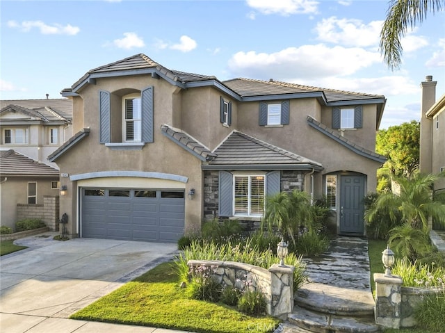 29243 Discovery Ridge Dr, Saugus, CA 91390 - view of front facade with an attached garage, driveway, and a tile roof