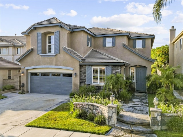 29243 Discovery Ridge Dr, Saugus, CA 91390 - view of front facade featuring a garage, a tiled roof, concrete driveway, and stucco siding