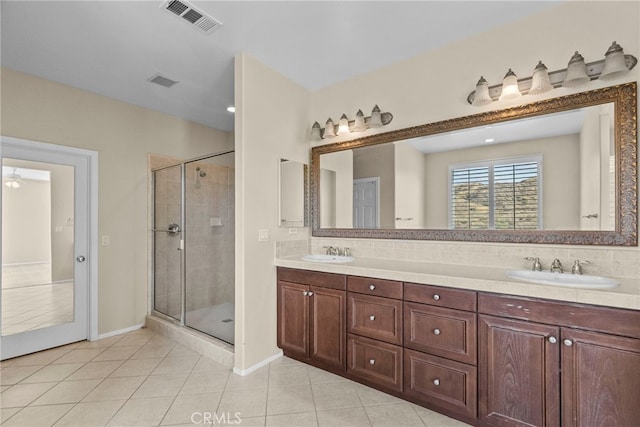 29243 Discovery Ridge Dr, Saugus, CA 91390 - full bathroom with double vanity, a shower stall, and tile patterned flooring