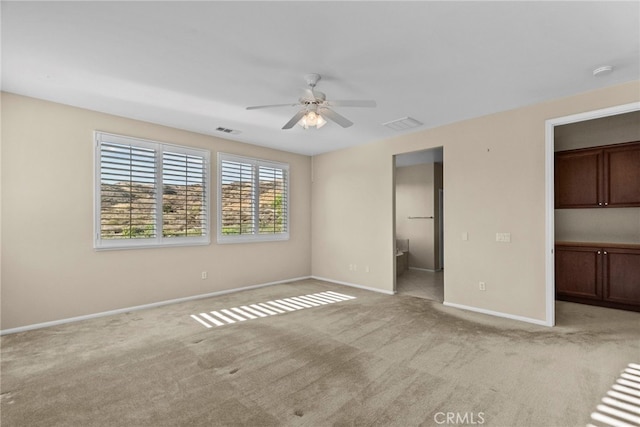 29243 Discovery Ridge Dr, Saugus, CA 91390 - unfurnished bedroom featuring light colored carpet, a walk in closet, and a ceiling fan