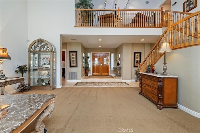 10847 Leota Ln, Riverside, CA 92503 - entryway with a high ceiling, stairway, and carpet