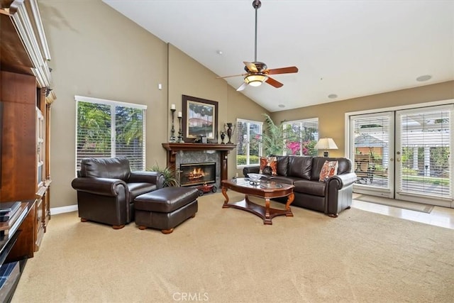 10847 Leota Ln, Riverside, CA 92503 - living area featuring a ceiling fan, a glass covered fireplace, plenty of natural light, high vaulted ceiling, and carpet floors