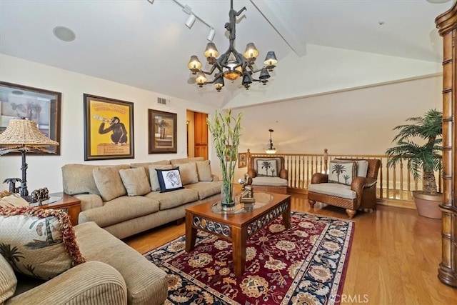 10847 Leota Ln, Riverside, CA 92503 - living room featuring a chandelier and light wood-style flooring