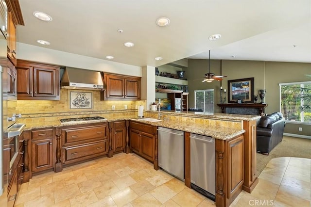 10847 Leota Ln, Riverside, CA 92503 - kitchen with appliances with stainless steel finishes, wall chimney exhaust hood, a peninsula, backsplash, and recessed lighting