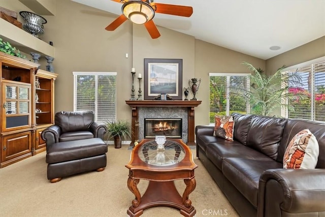10847 Leota Ln, Riverside, CA 92503 - carpeted living area featuring healthy amount of natural light, a ceiling fan, a glass covered fireplace, and high vaulted ceiling